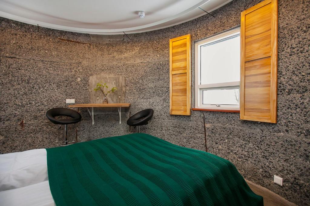 Postel nebo postele na pokoji v ubytování Klettar Tower Iceland