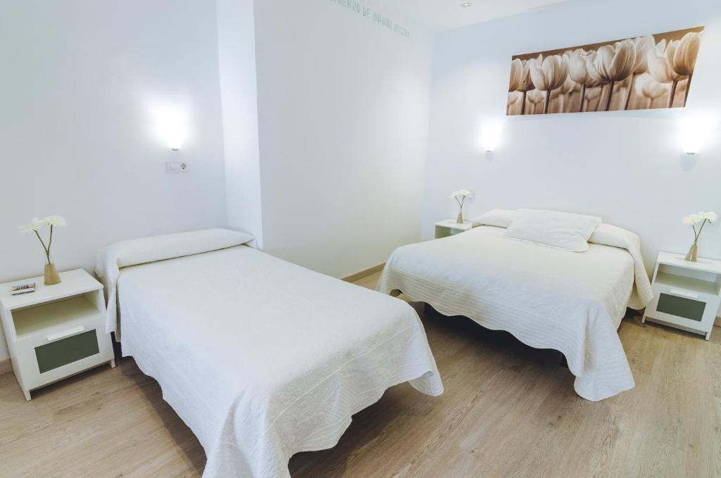 Posteľ alebo postele v izbe v ubytovaní Hospedaje Villanueva
