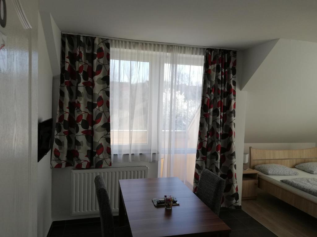 Postel nebo postele na pokoji v ubytování Apartman 25