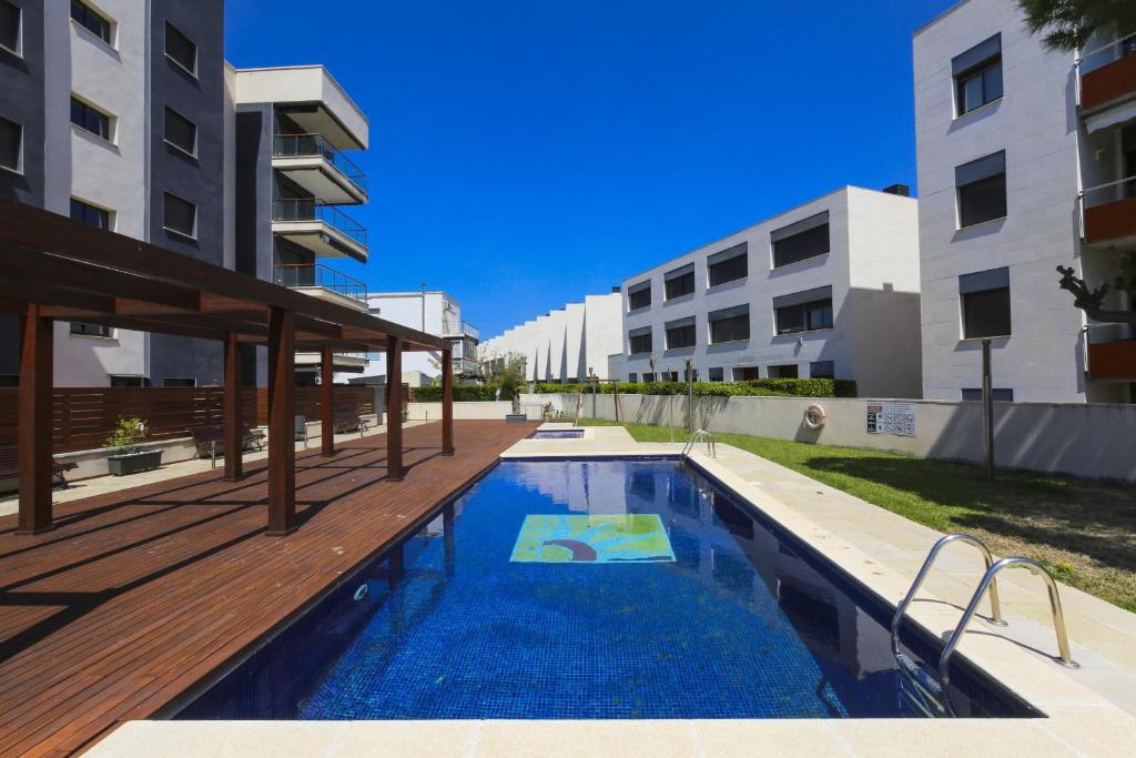 a swimming pool in the middle of a building at Tropicana Planet Costa Dorada in Cambrils