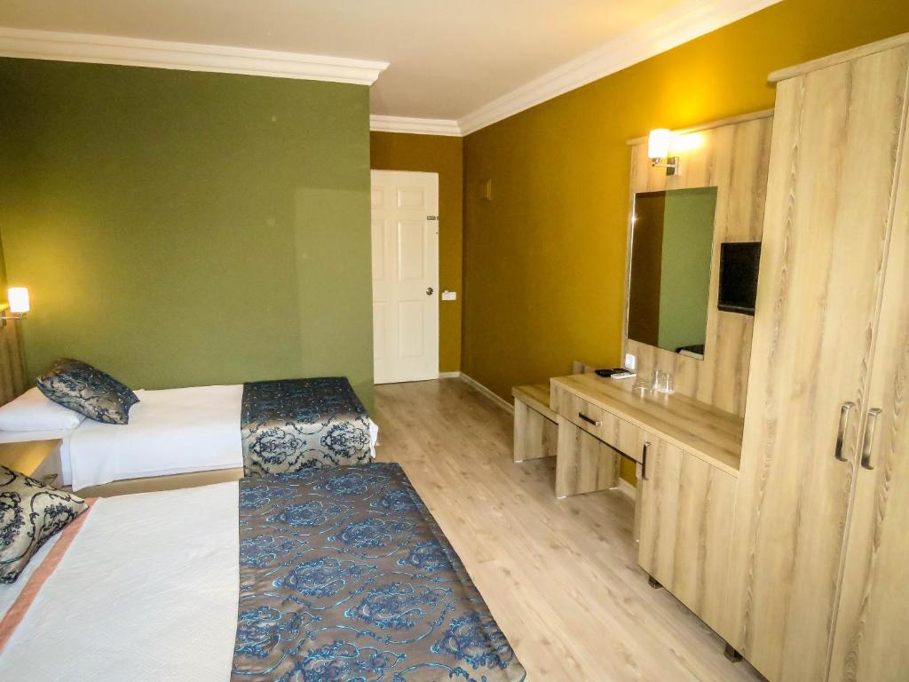 Postel nebo postele na pokoji v ubytování Remer Hotel