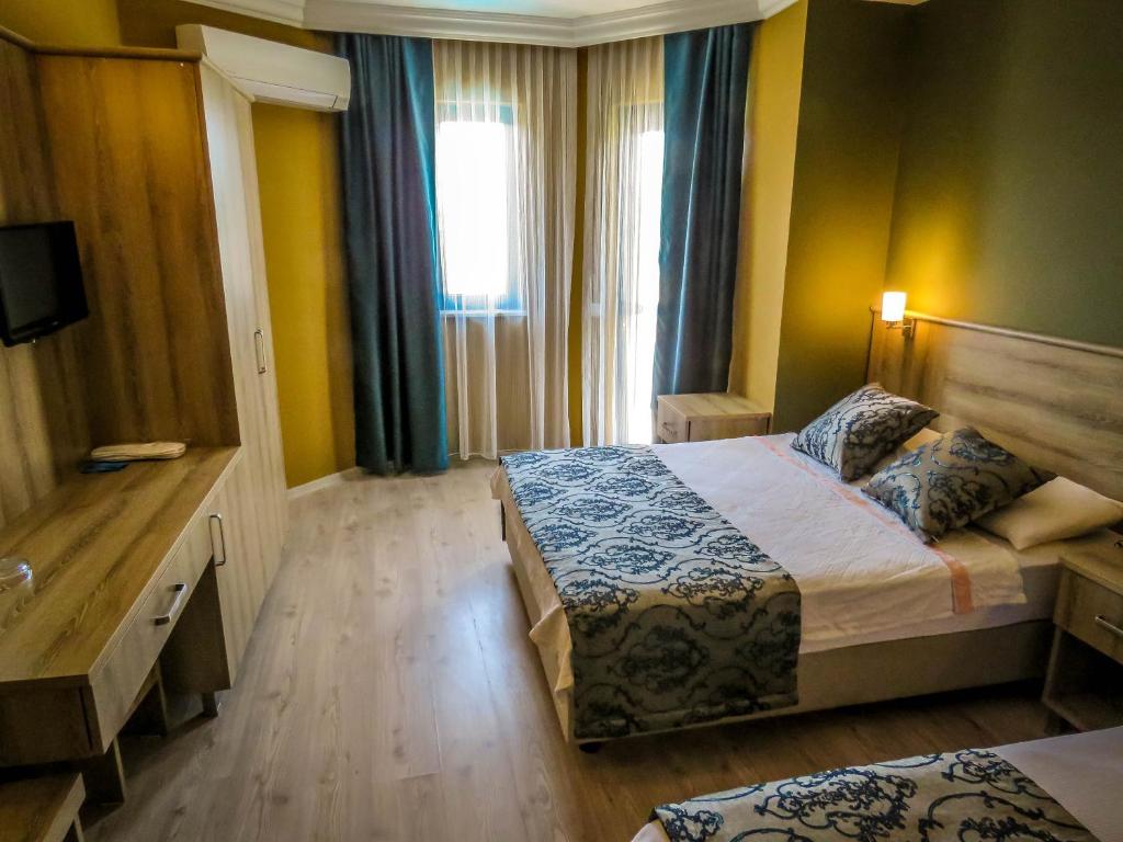 Postel nebo postele na pokoji v ubytování Remer Hotel