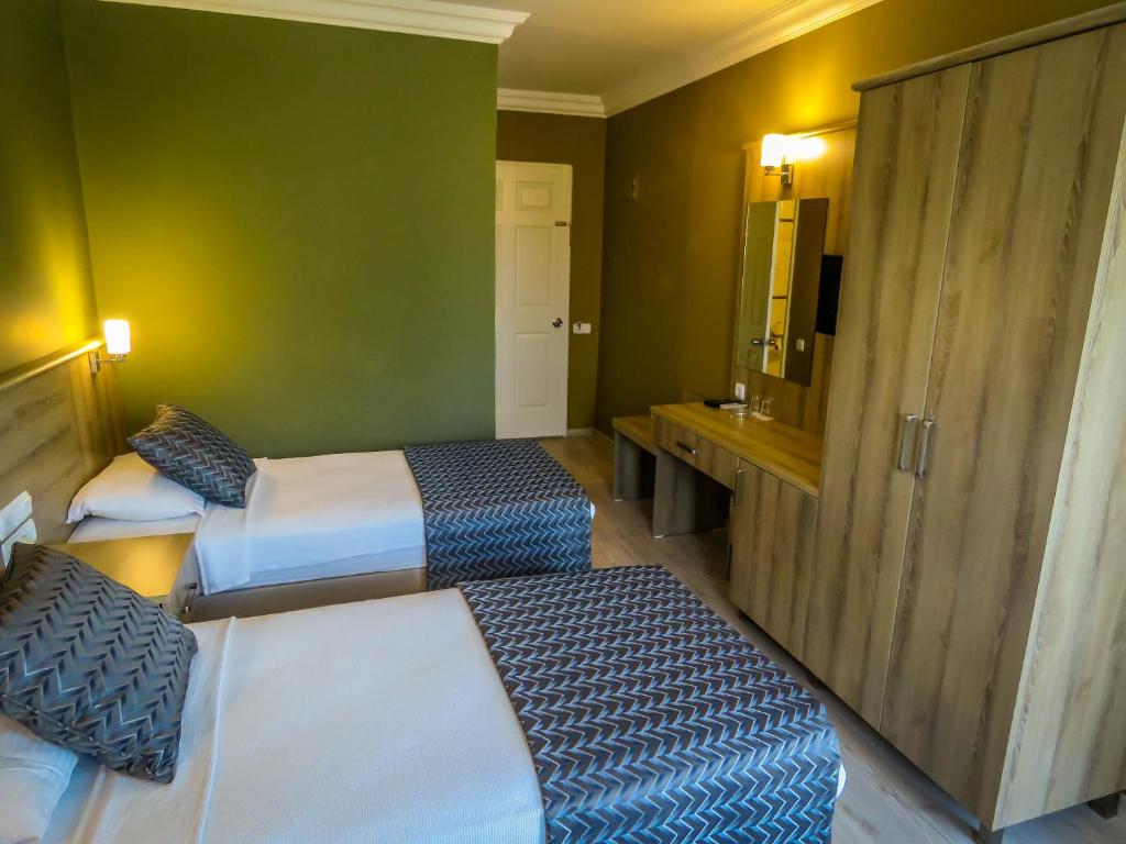 Postel nebo postele na pokoji v ubytování Remer Hotel