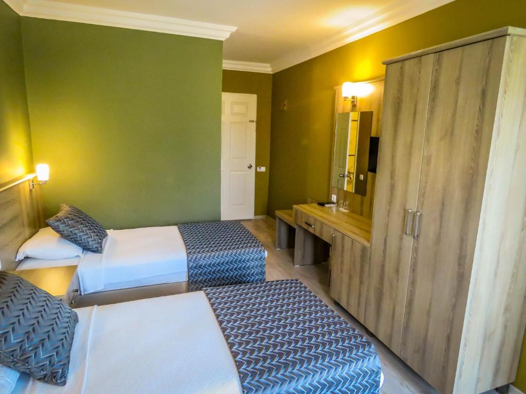 Postel nebo postele na pokoji v ubytování Remer Hotel