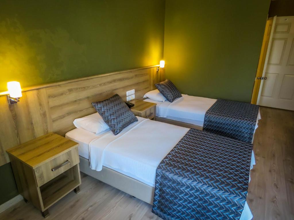 Postel nebo postele na pokoji v ubytování Remer Hotel