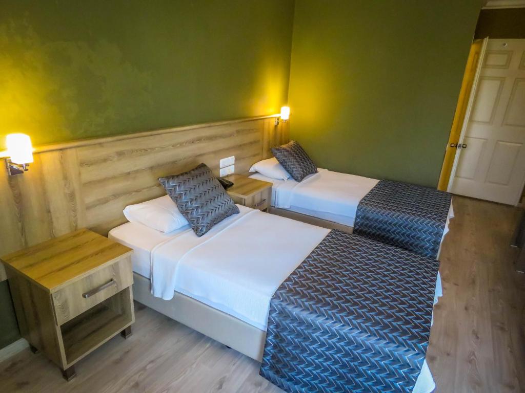 Postel nebo postele na pokoji v ubytování Remer Hotel
