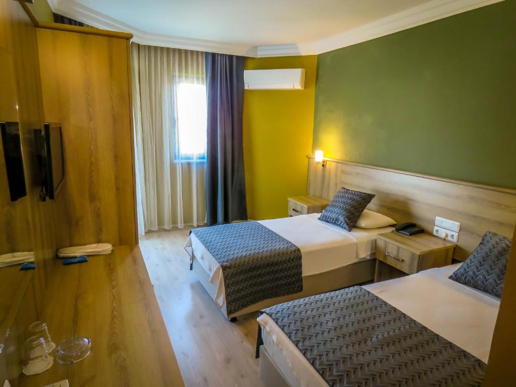 Postel nebo postele na pokoji v ubytování Remer Hotel