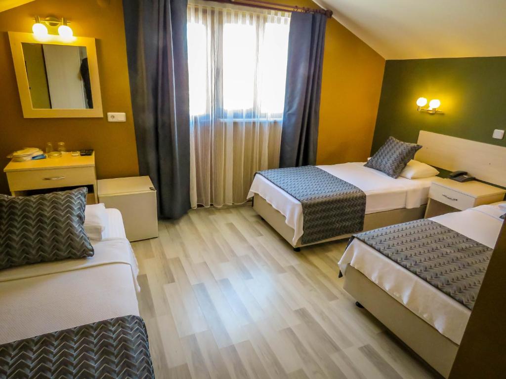 Postel nebo postele na pokoji v ubytování Remer Hotel