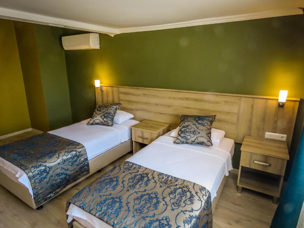 Postel nebo postele na pokoji v ubytování Remer Hotel