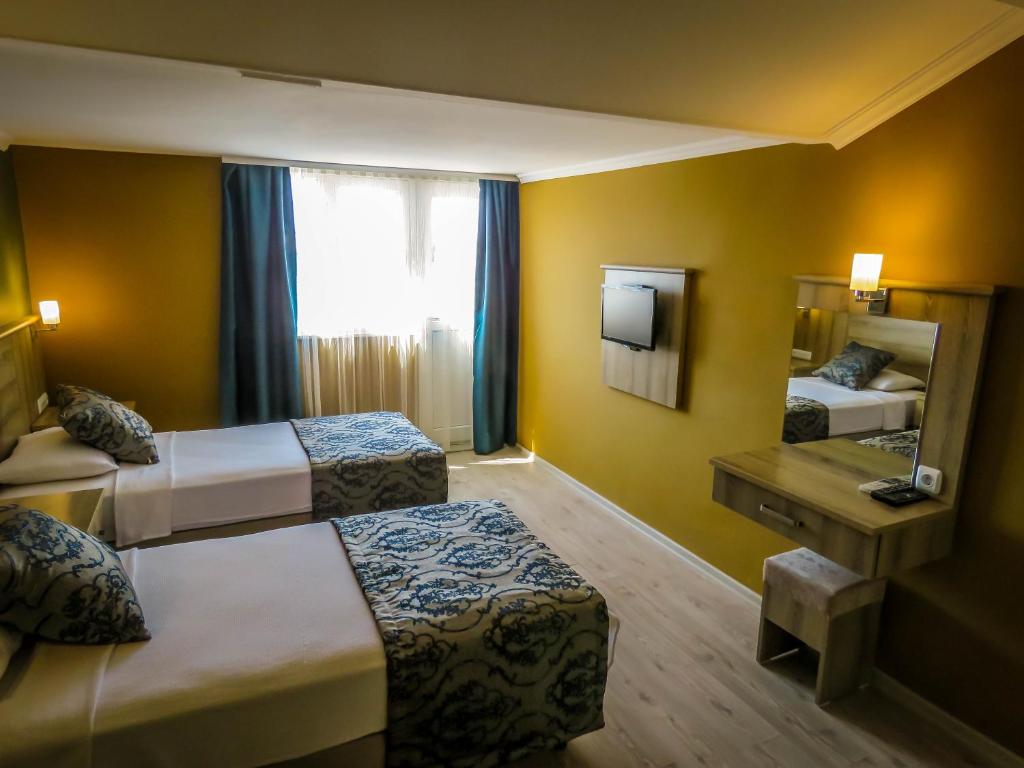 Postel nebo postele na pokoji v ubytování Remer Hotel