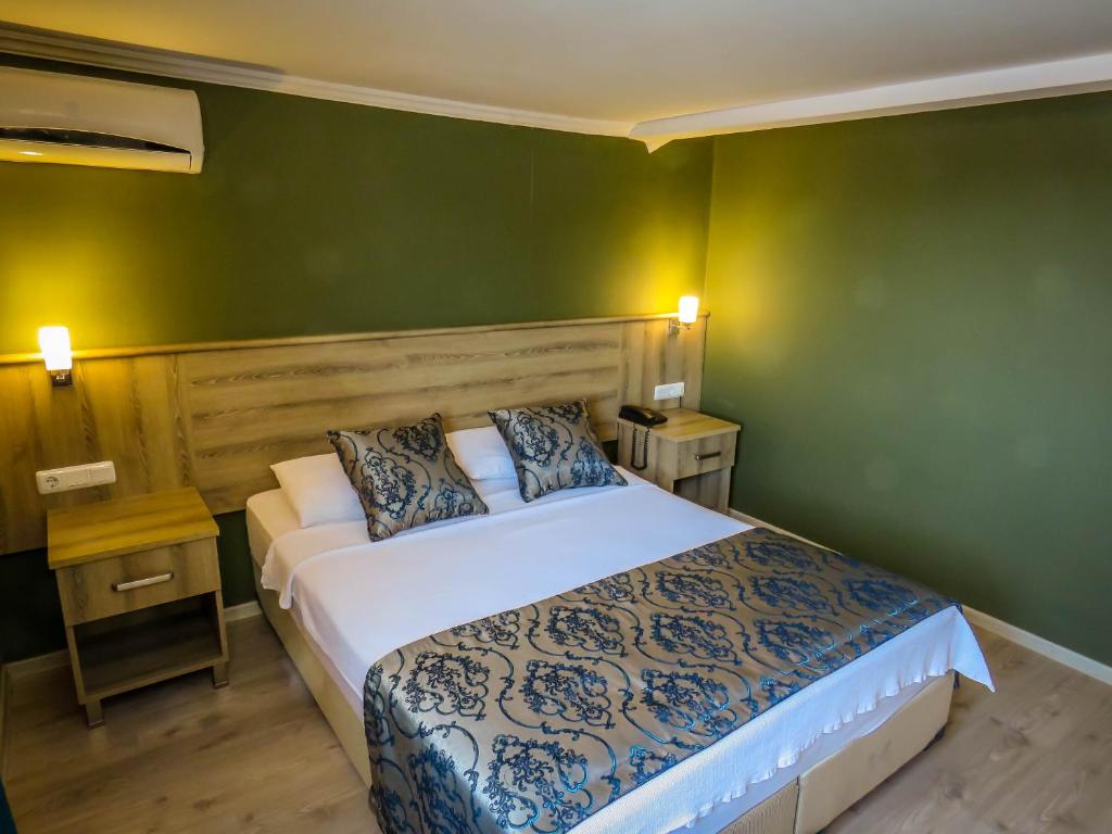Postel nebo postele na pokoji v ubytování Remer Hotel