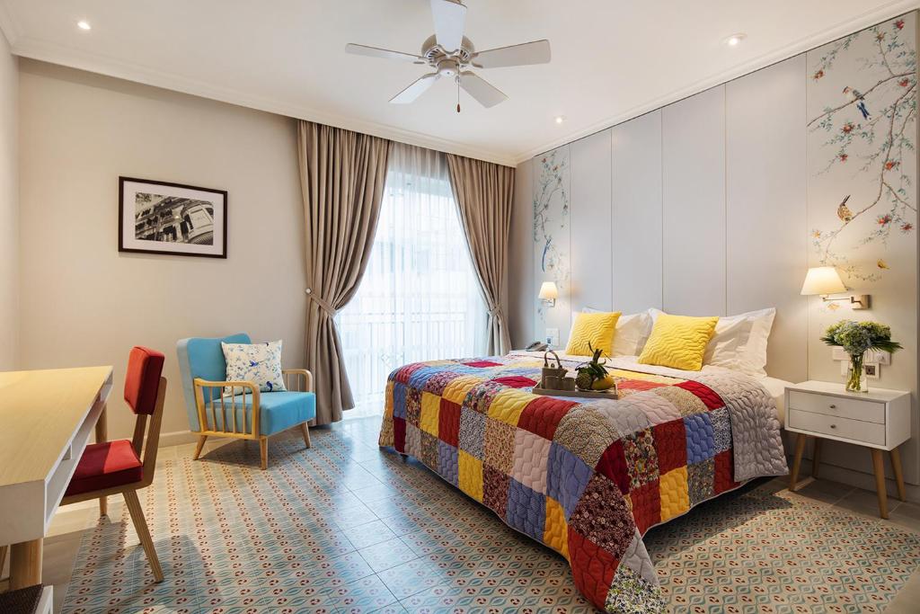 Postel nebo postele na pokoji v ubytování Maison De Camille Boutique Hotel