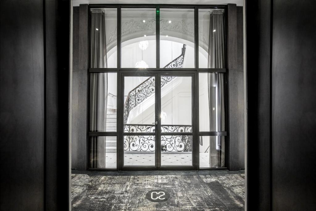 an open door with a view of a staircase at Hotel C2 in Marseille