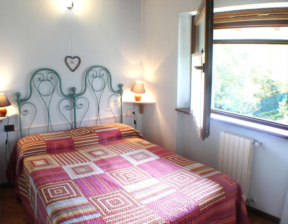 Posteľ alebo postele v izbe v ubytovaní Villa Erica con piscina privata sul lago di Como