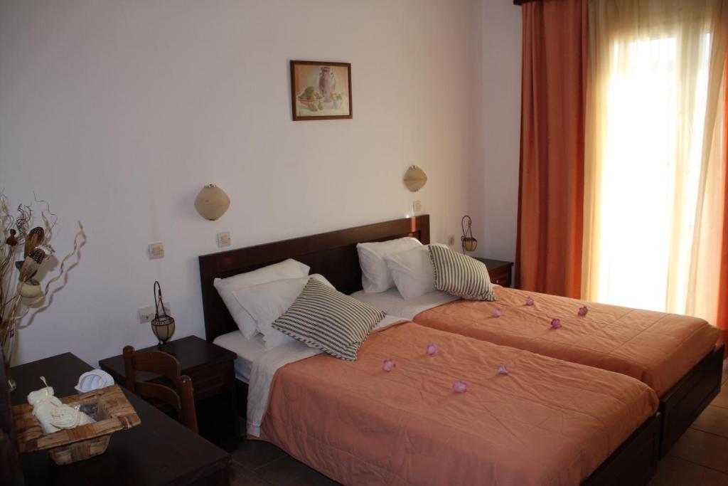 Postel nebo postele na pokoji v ubytování Joy Hotel