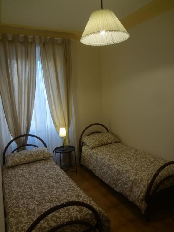 Posteľ alebo postele v izbe v ubytovaní Accademia Apartment