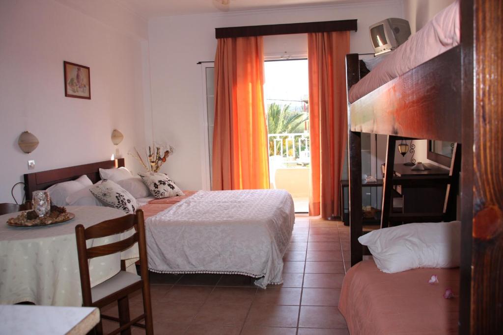 Postel nebo postele na pokoji v ubytování Joy Hotel