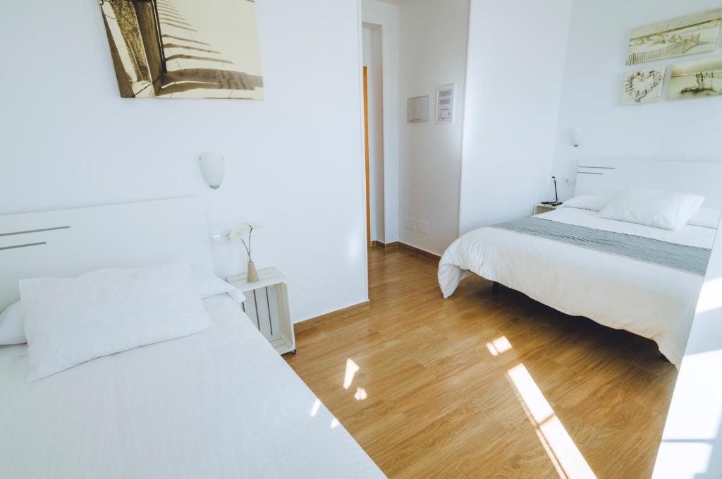 Posteľ alebo postele v izbe v ubytovaní Hospedaje Villanueva