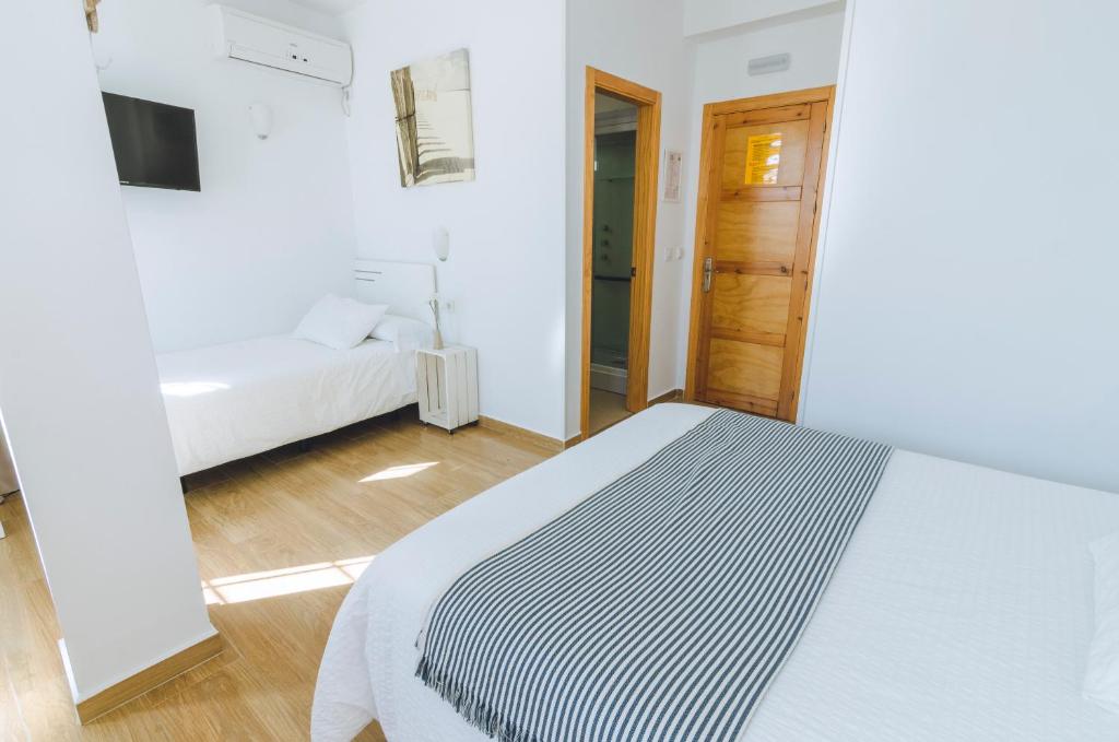 Posteľ alebo postele v izbe v ubytovaní Hospedaje Villanueva