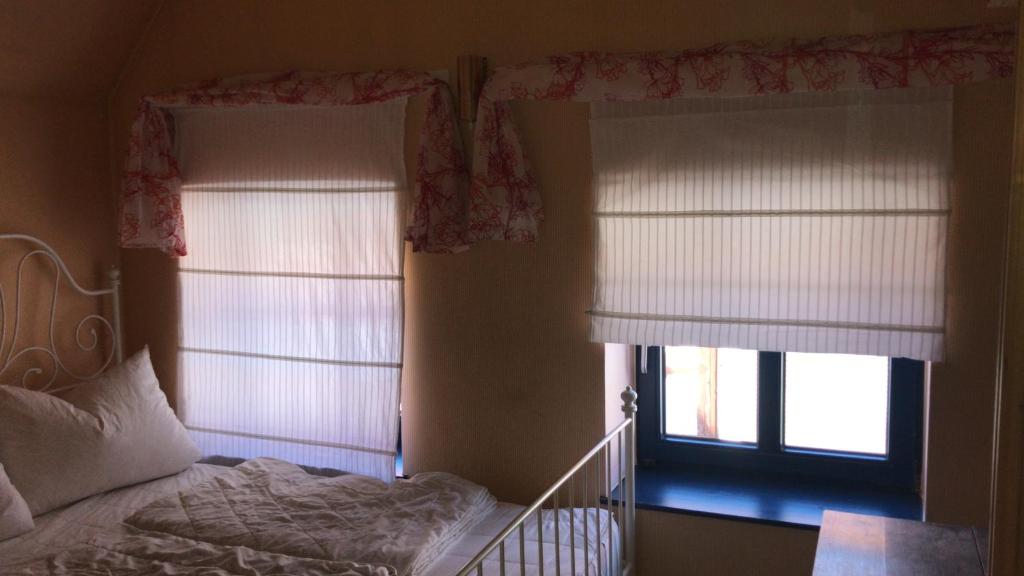 Ein Bett oder Betten in einem Zimmer der Unterkunft Hotel Senfkorn