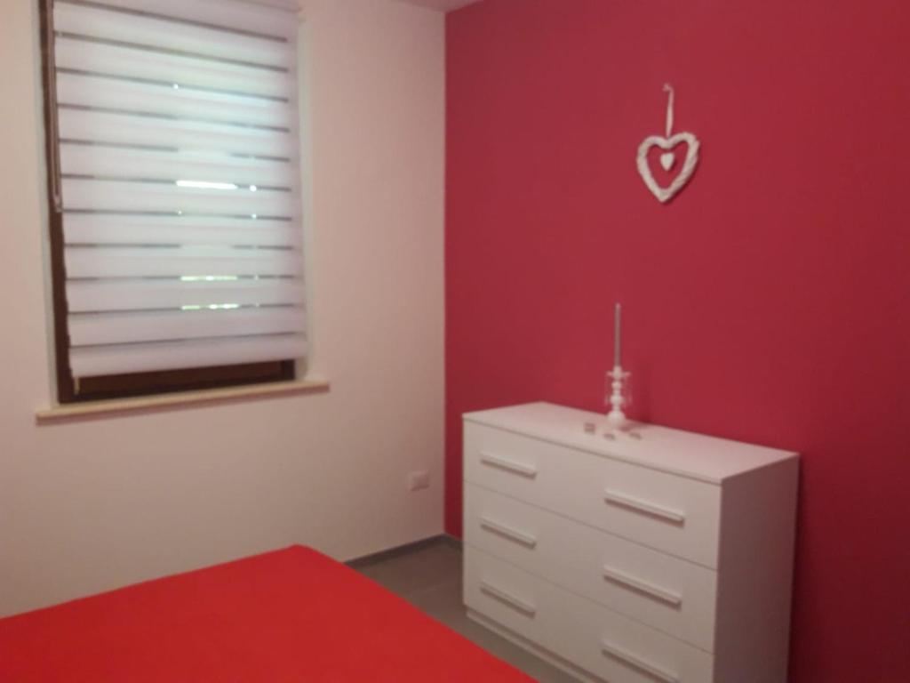 A bed or beds in a room at Tulipano Appartamenti