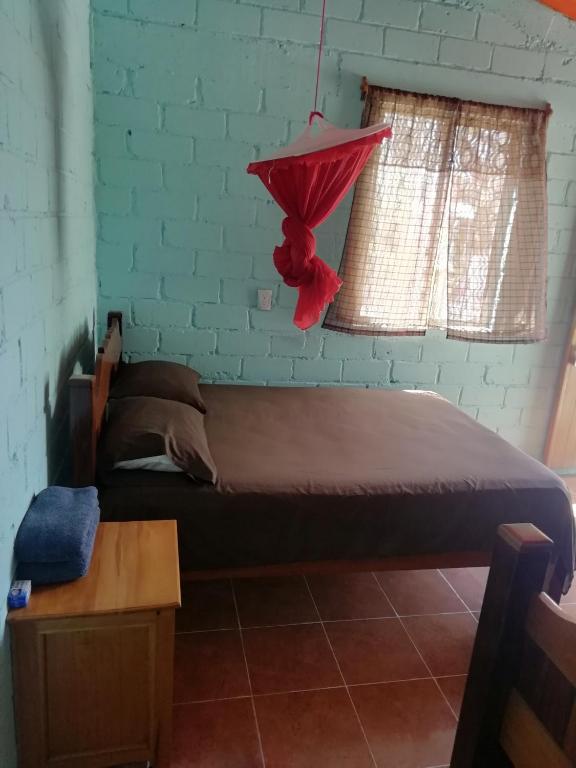 Postel nebo postele na pokoji v ubytování Cabanas chaac calakmul