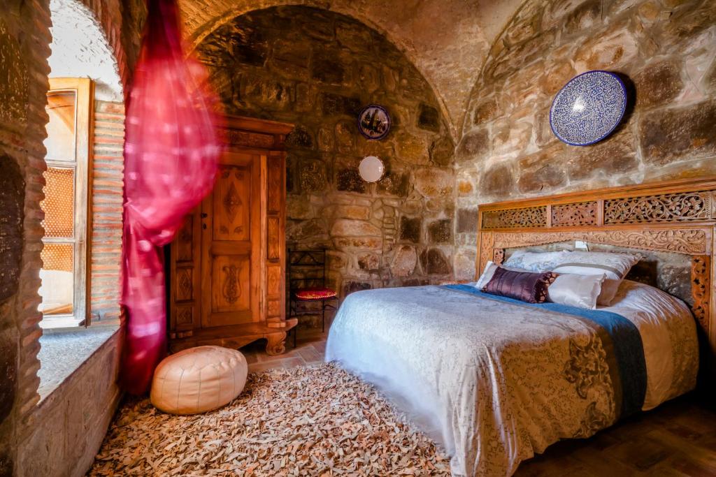 Cama o camas de una habitación en Hostal El Asturiano