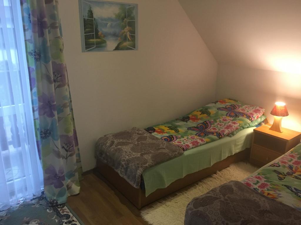 Posteľ alebo postele v izbe v ubytovaní Domek pod Maciejową