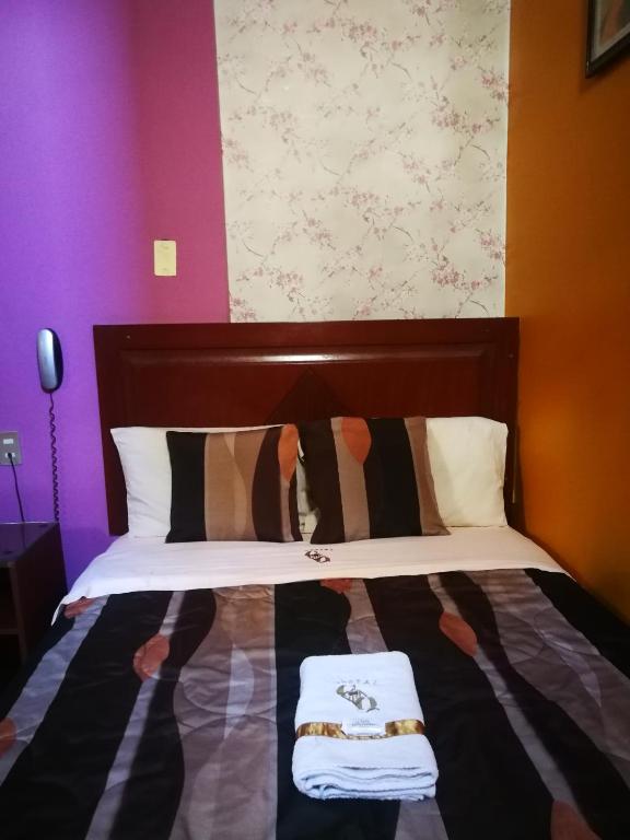 Postel nebo postele na pokoji v ubytování Hostal GQ