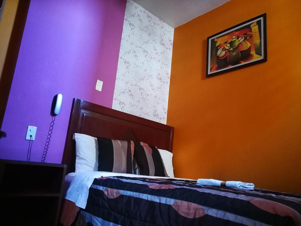 Postel nebo postele na pokoji v ubytování Hostal GQ