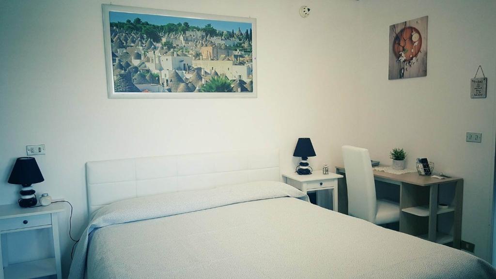 Katil atau katil-katil dalam bilik di Hotel Falco D'oro