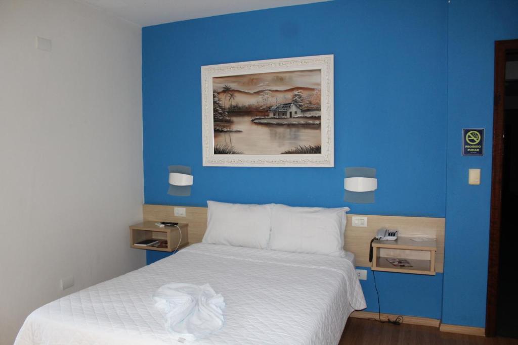 Postel nebo postele na pokoji v ubytování Hotel Dom Thomaz