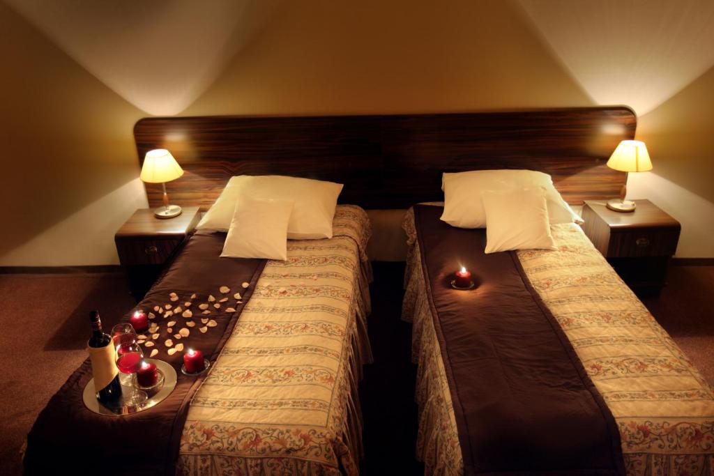 Posteľ alebo postele v izbe v ubytovaní Hotel Wit Stwosz