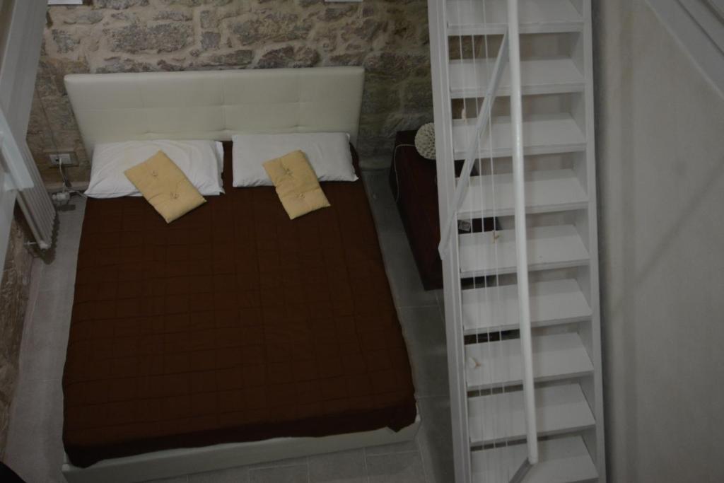Postel nebo postele na pokoji v ubytování B&B DOMUS GAIA