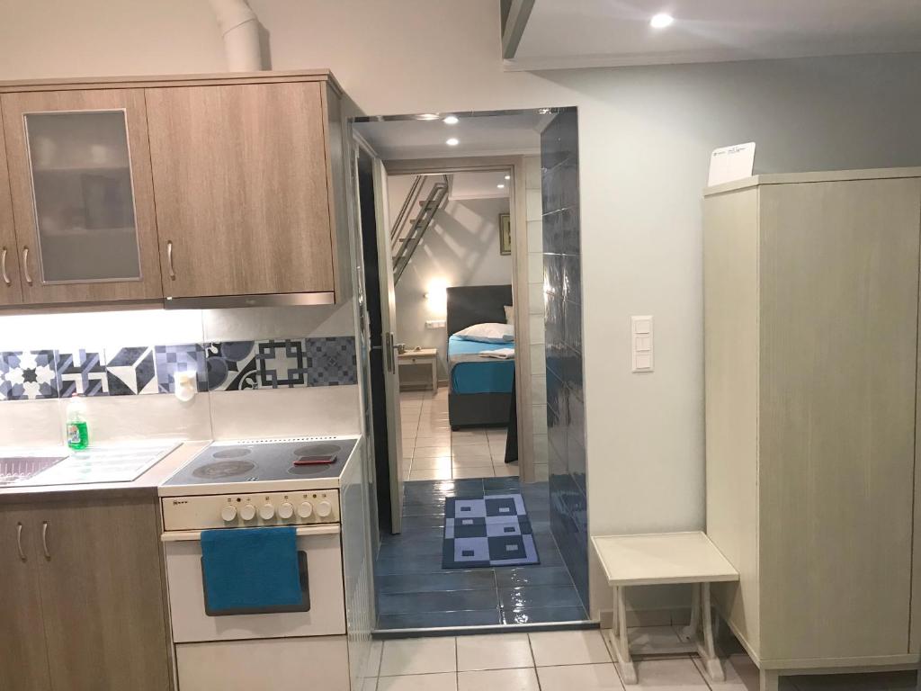 Kuchyňa alebo kuchynka v ubytovaní Odyssey Apartment