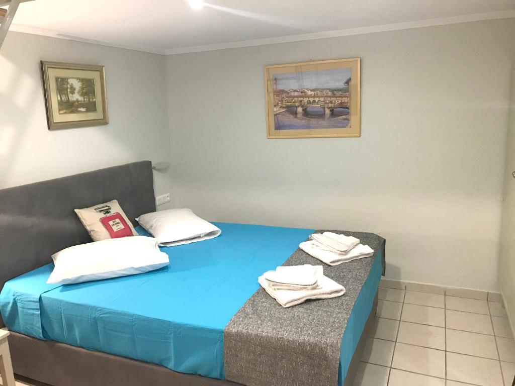 Posteľ alebo postele v izbe v ubytovaní Odyssey Apartment