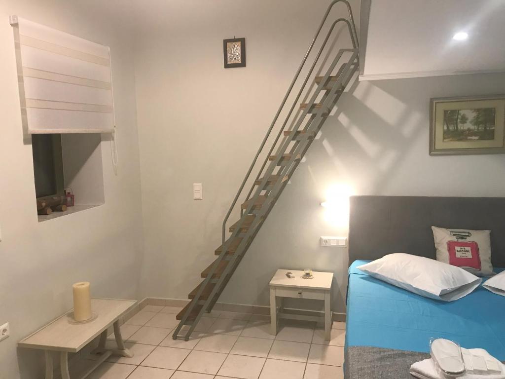 Posteľ alebo postele v izbe v ubytovaní Odyssey Apartment