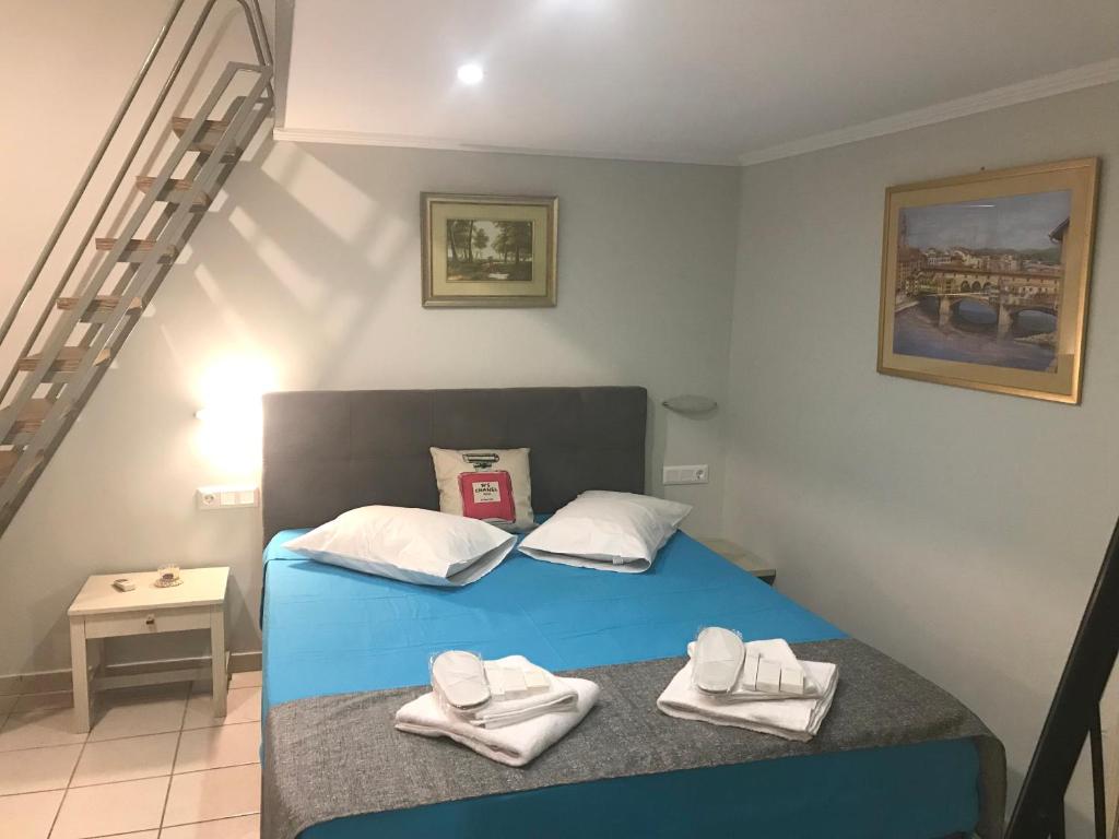 Posteľ alebo postele v izbe v ubytovaní Odyssey Apartment