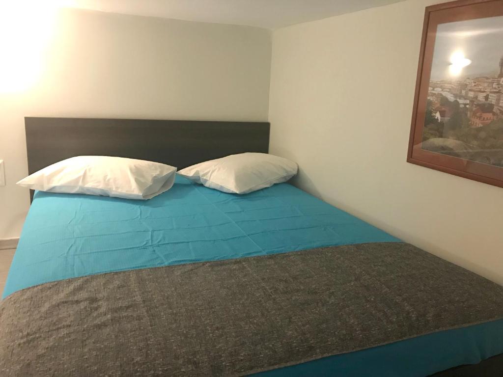 Posteľ alebo postele v izbe v ubytovaní Odyssey Apartment