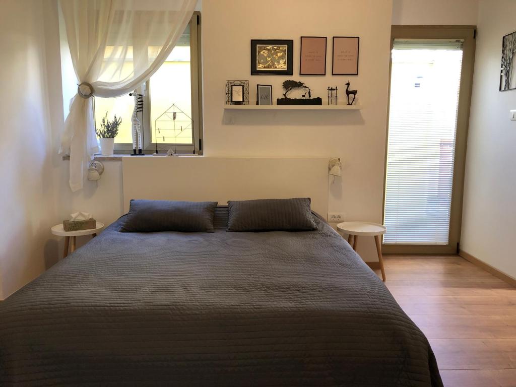 Łóżko lub łóżka w pokoju w obiekcie Apartment Check in