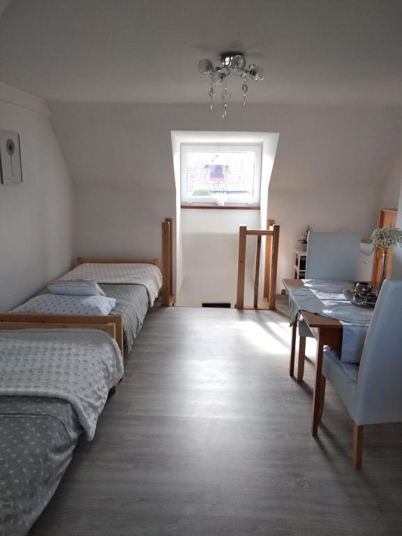Posteľ alebo postele v izbe v ubytovaní Domek Mazury Harsz