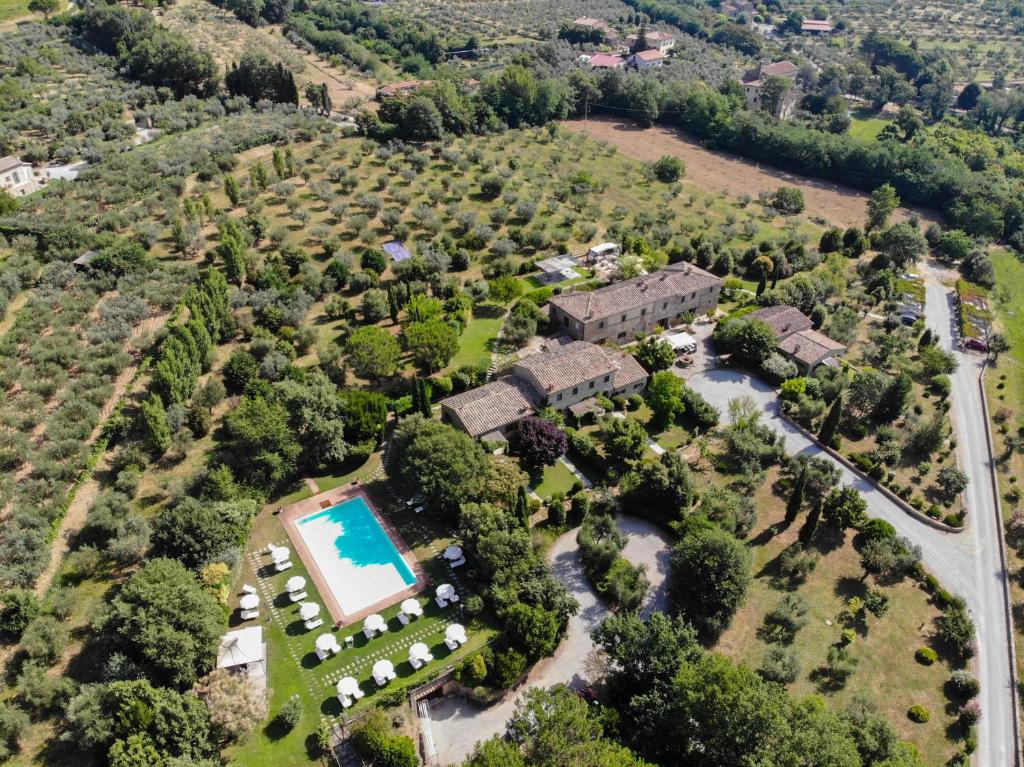 an aerial view of a estate with a pool at Villa Borgo San Pietro in Cortona