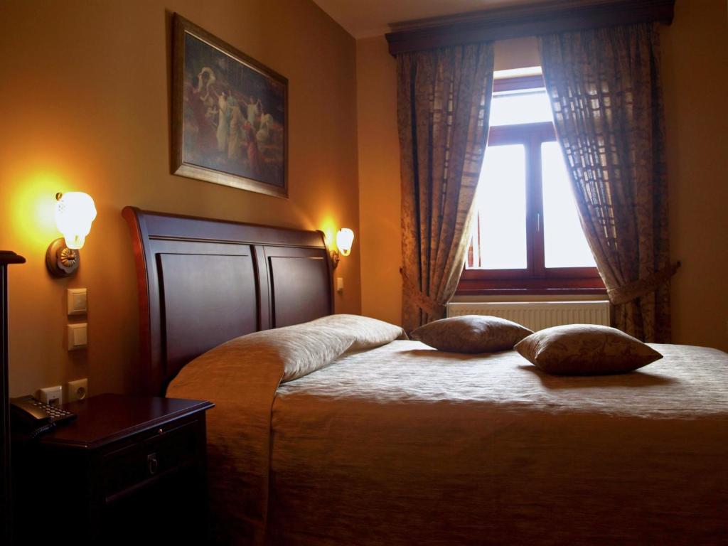 מיטה או מיטות בחדר ב-Amanites Guesthouse