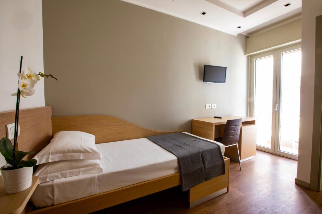 Postel nebo postele na pokoji v ubytování Hotel Liane Riccione