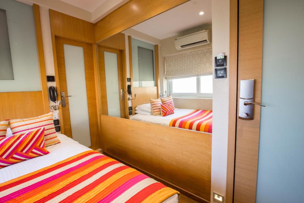 Uma cama ou camas num quarto em Hotel Bawa Continental