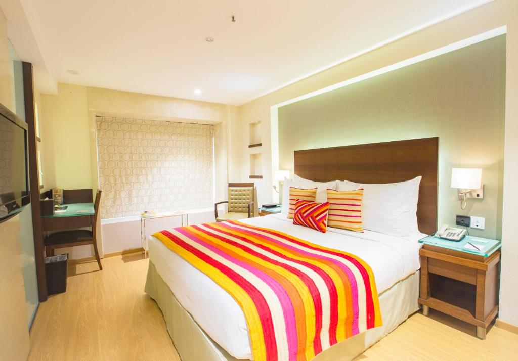 Uma cama ou camas num quarto em Hotel Bawa Continental