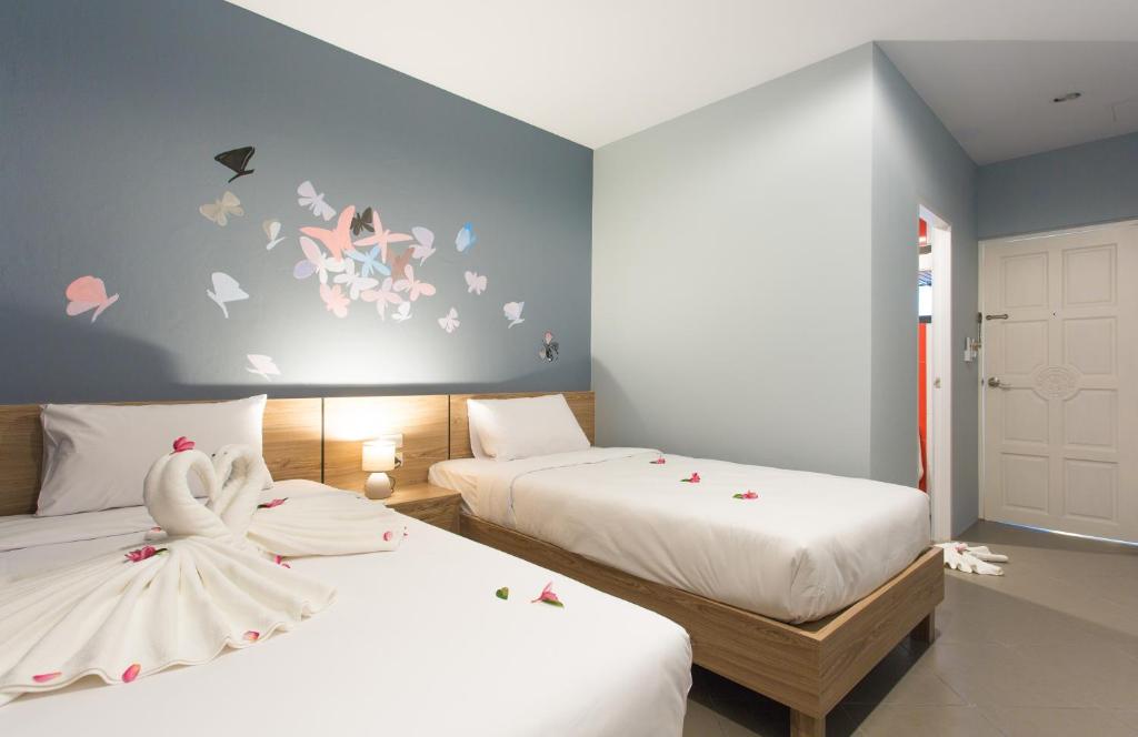 Postel nebo postele na pokoji v ubytování iNest Poshtel
