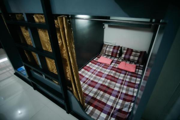 Voodi või voodid majutusasutuse Sleepadz - Capsule Beds Dormitel in Magsaysay Ave Naga toas