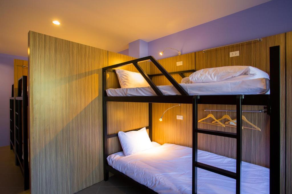 Postel nebo postele na pokoji v ubytování iNest Poshtel