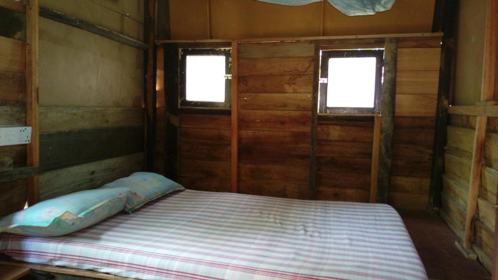 Postel nebo postele na pokoji v ubytování Beach Hut
